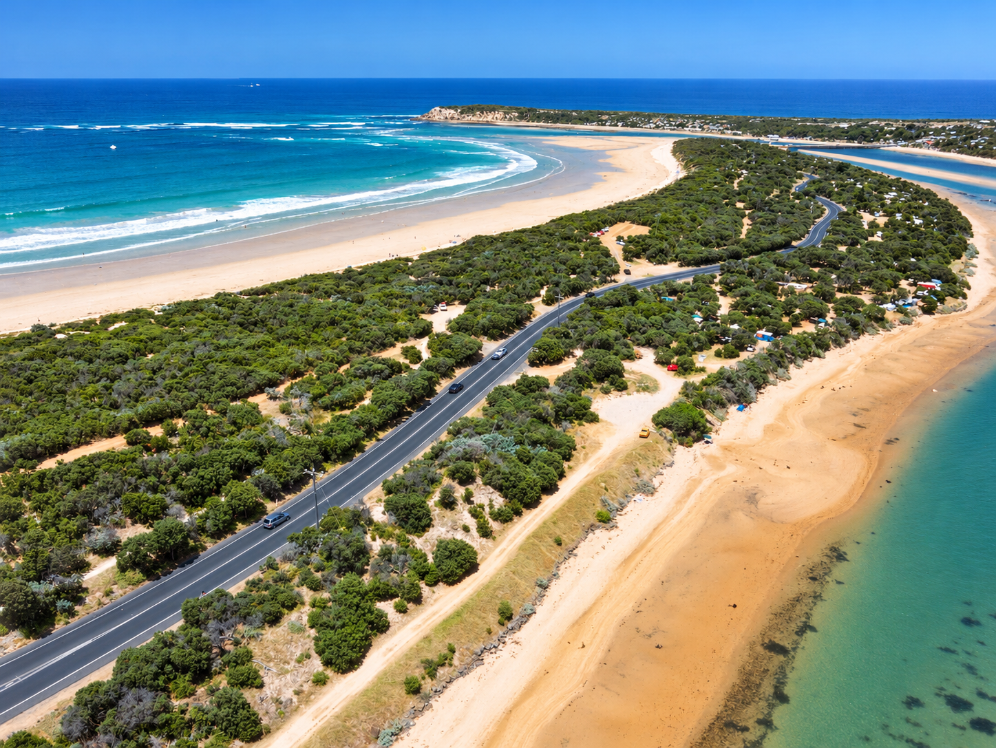 Aerial view of the Ocean Grove beach, Barwon River mouth and Barwon Heads Road